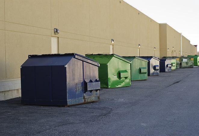 a row of industrial dumpsters at a construction site in Canby